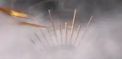 Golden lightning bolt rises from mist
