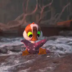 Baby duckling eats purple fish