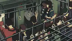 Crowded train with passengers holding handrails