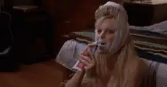 Woman brushing teeth with shaving cream