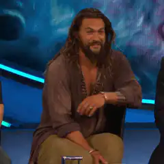 Jason Momoa smiling and turning around