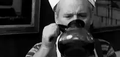 Chef drinking from a large glass