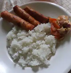 plate of rice sausages and chicken stew