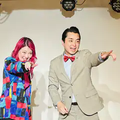 Man and woman pointing forward