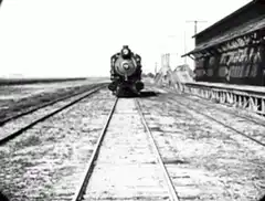 Train approaching with box head man