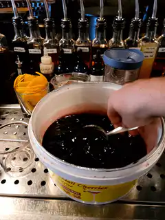 Scooping maraschino cherries