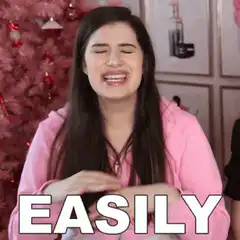 Woman saying easily with pink christmas tree