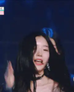 K-pop idol winking and waving