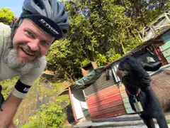 Cyclist selfie with goat