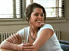 Neve Campbell smiling and talking