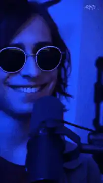 Person in sunglasses smiling then serious