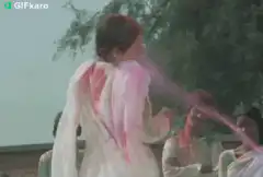 Woman throwing pink powder