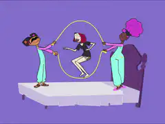 three girls jump rope on a bed