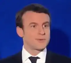 Emmanuel Macron smiling and nodding
