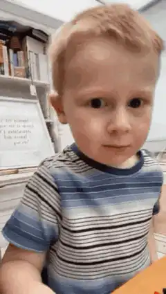 blonde boy looking at camera