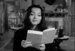 Woman reading book eyes widen