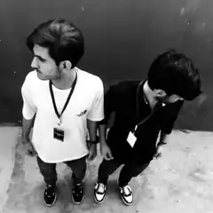 Two men standing back to back