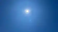 Bright sun in blue sky
