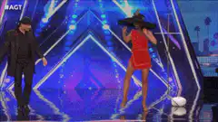 Woman's dress transforms on stage