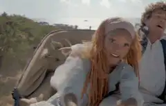 Ariel and Eric in a carriage