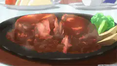 sizzling meat on a hot plate