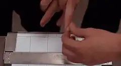 Fingerprints being rolled onto card