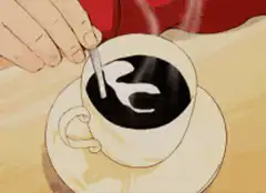 Hand stirring coffee with spoon