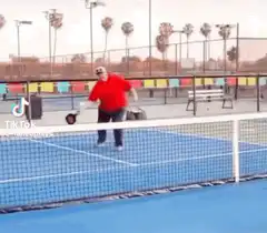 Man falls over tennis net