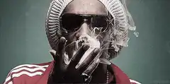 Snoop Dogg exhaling smoke