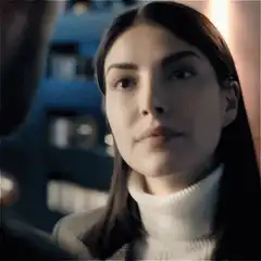 Woman looking up with a slight smile
