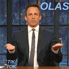 Seth Meyers shrugs then points