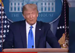 Donald Trump points at camera