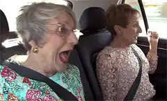 Elderly women screaming in a car