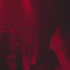 Woman smoking in red light