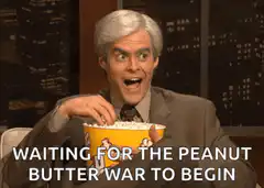 Bill Hader eating popcorn waiting for peanut butter war