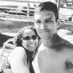 Couple smiling at poolside