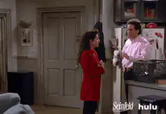 Elaine bursts through the door
