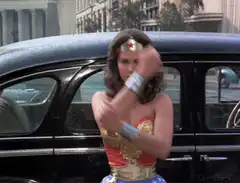 Wonder Woman deflects bullets with bracelets