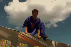 Man falls off ladder and hugs wrecking ball