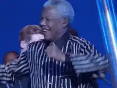 Nelson Mandela laughing and pointing