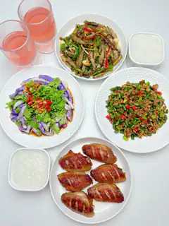 assorted chinese dishes on white plates