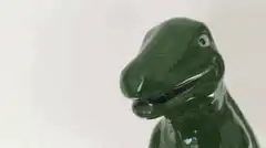 Green dinosaur head with MOAR text