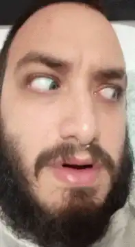 Man with beard rolling eyes