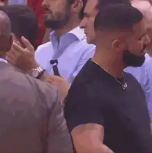 Drake reacts with hands on head