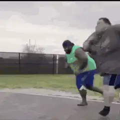 Large man falls while playing basketball