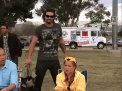 Jesse Pinkman sits down in a folding chair