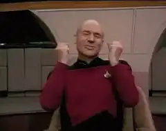 Picard celebrating with fists raised