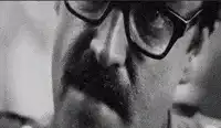 Man with glasses and mustache saying for ever