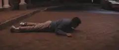 Man crawling on driveway