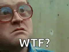 Close up of man with glasses saying WTF